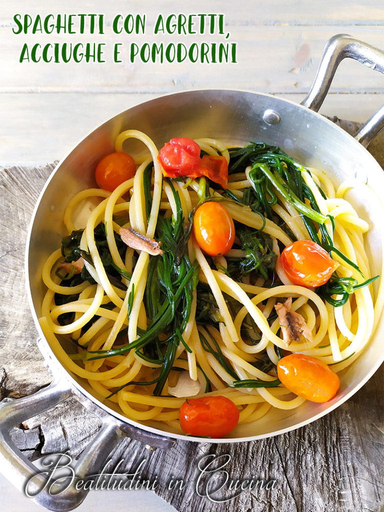 Spaghetti con agretti, acciughe e pomodorin